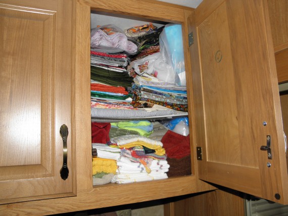 fabric in the linen closet, fabric storage, organizing