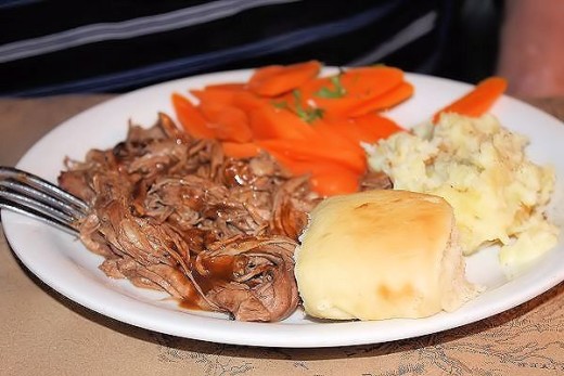 Bison pot roast with mashed potatoes and roasted carrots. 