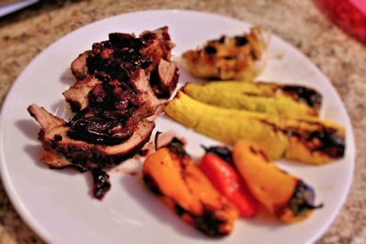 Pork tenderloin with Ginger Cherry Sauce and grilled vegetables. 