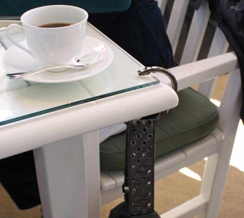 Hang your purse from the table with Clipa